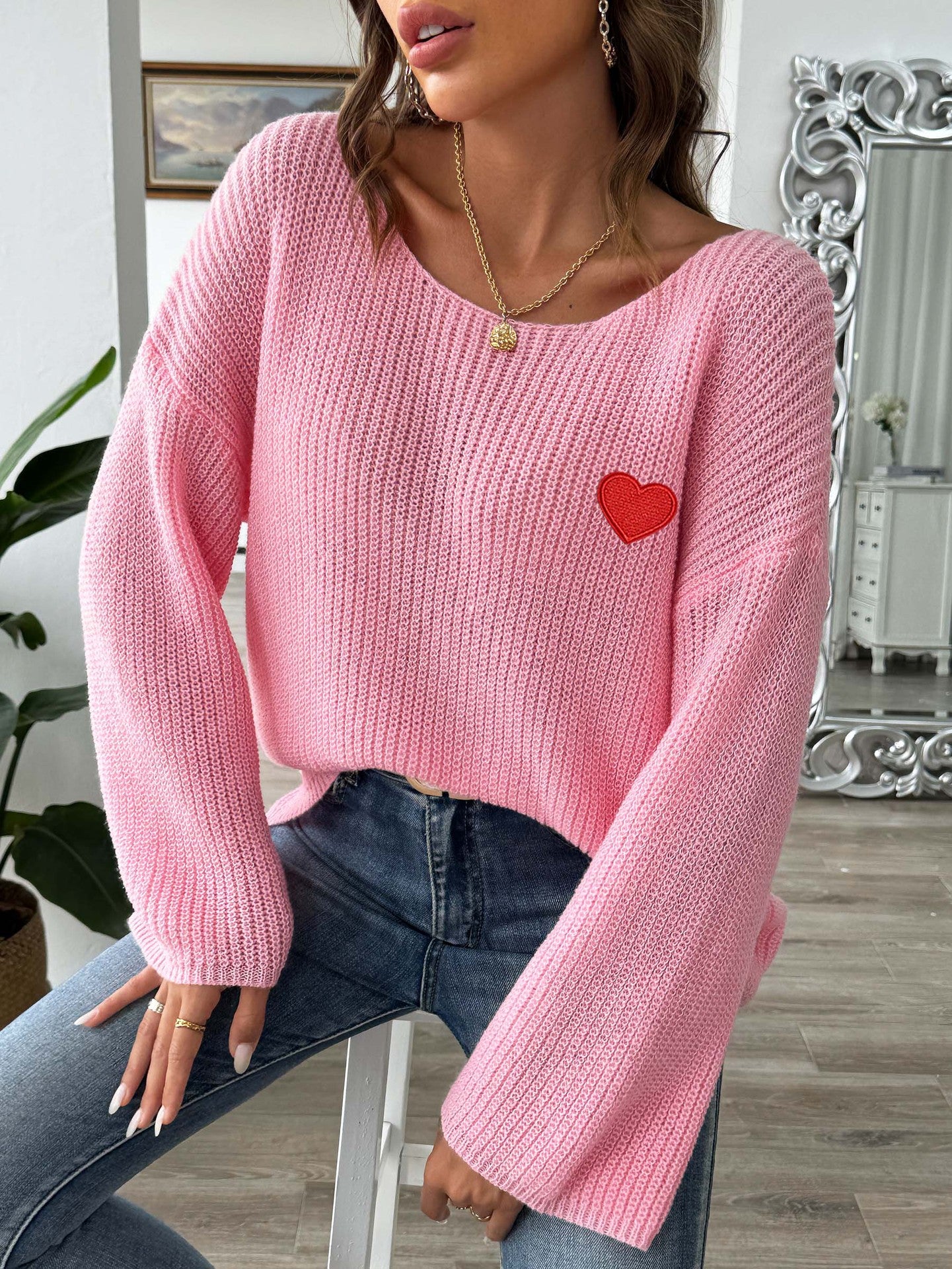 one shoulder flared sleeve sweater with heart embroidery
