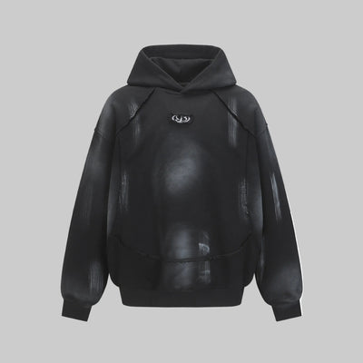 Hairy edge washed and spray dyed hoodie
